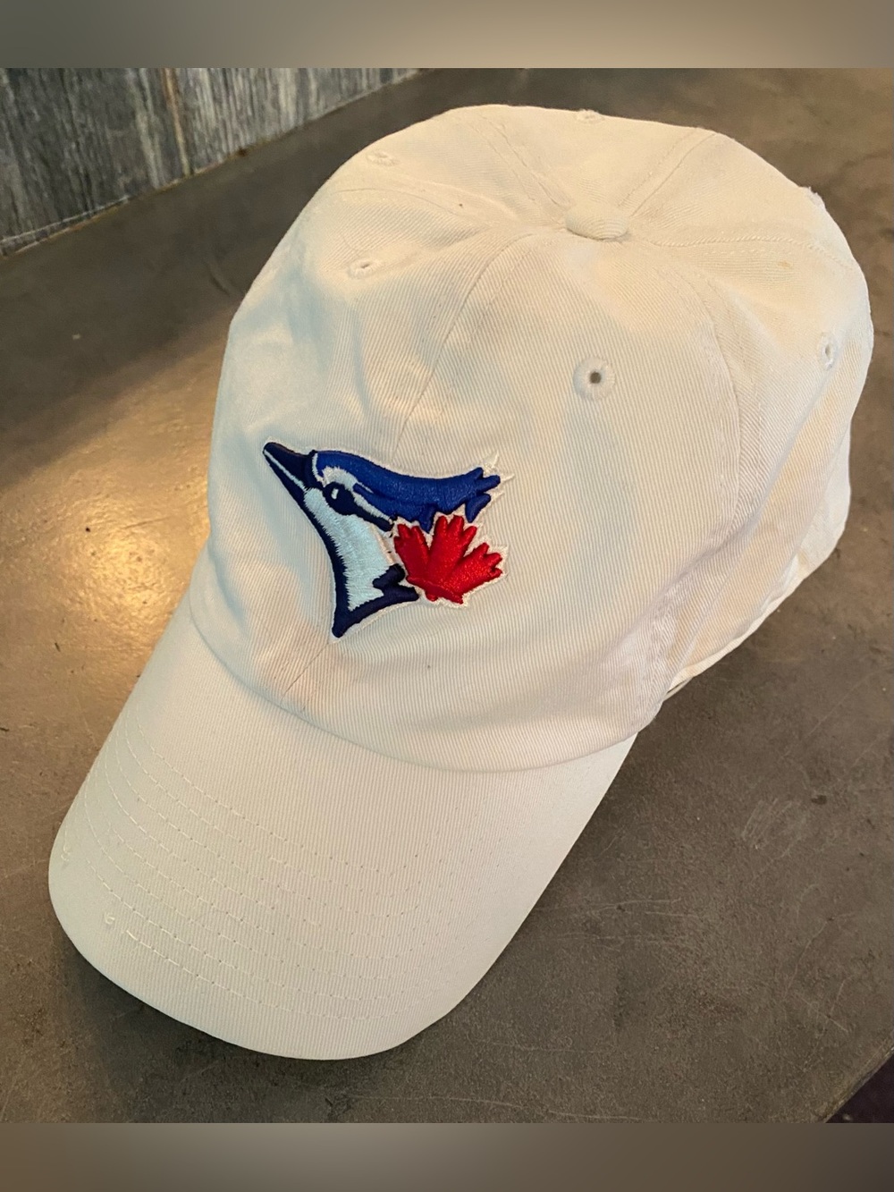 47 White Baseball Cap with Blue Jay Logo and Red Maple Accent